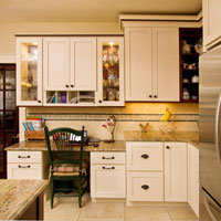Light wood cabinets with granite kitchen counter tops