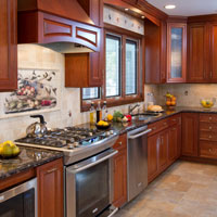 Medium brown kitchen cabinets with granite counter tops