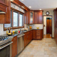 Medium brown kitchen cabinets with granite counter tops