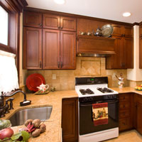 Light wood ktichen cabinets and granite counter top