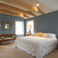 Light wood rafters in bedroom