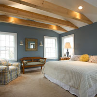 Light wood rafters in bedroom